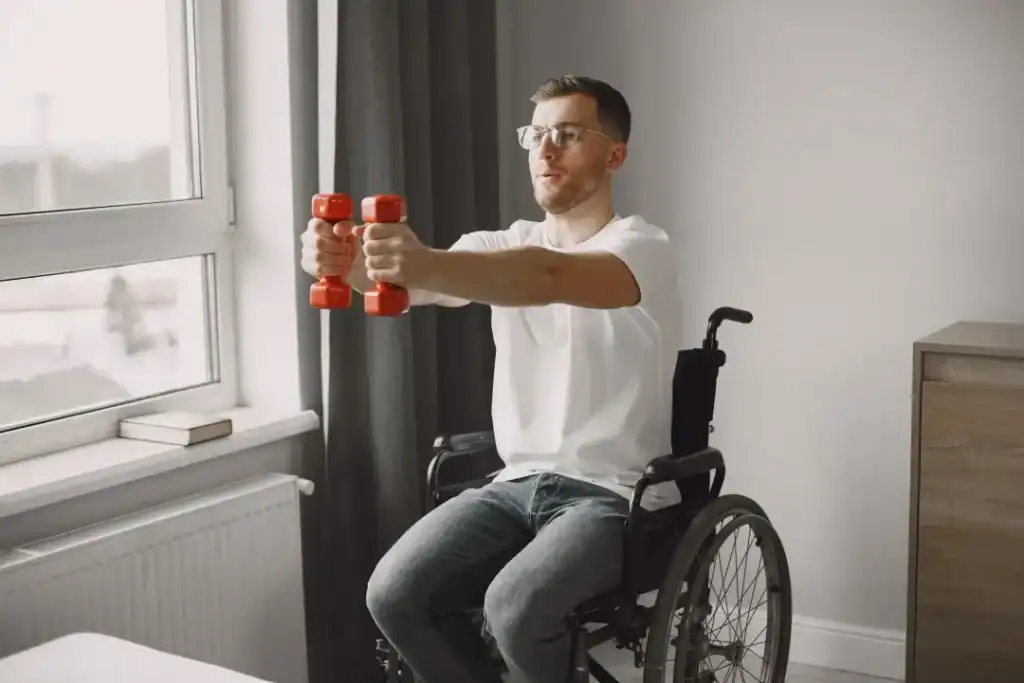 Image of man doing exercise in his wheelchair to aid weight loss Uckfield