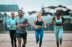 Sculpting Sleek Arms: The Essential Role of Cardio in Toning Without Bulking Up 3 image of people running to incorporate cardio Uckfield exercise into their life to help tone arms and body.