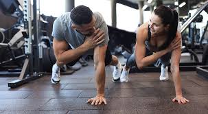 Sculpting Sleek Arms: The Essential Role of Cardio in Toning Without Bulking Up 1 Image of man and woman doing Cardio Uckfield to tone their arms.